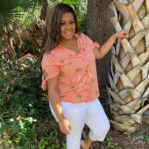 Orange blouse with white stripes and flamingos